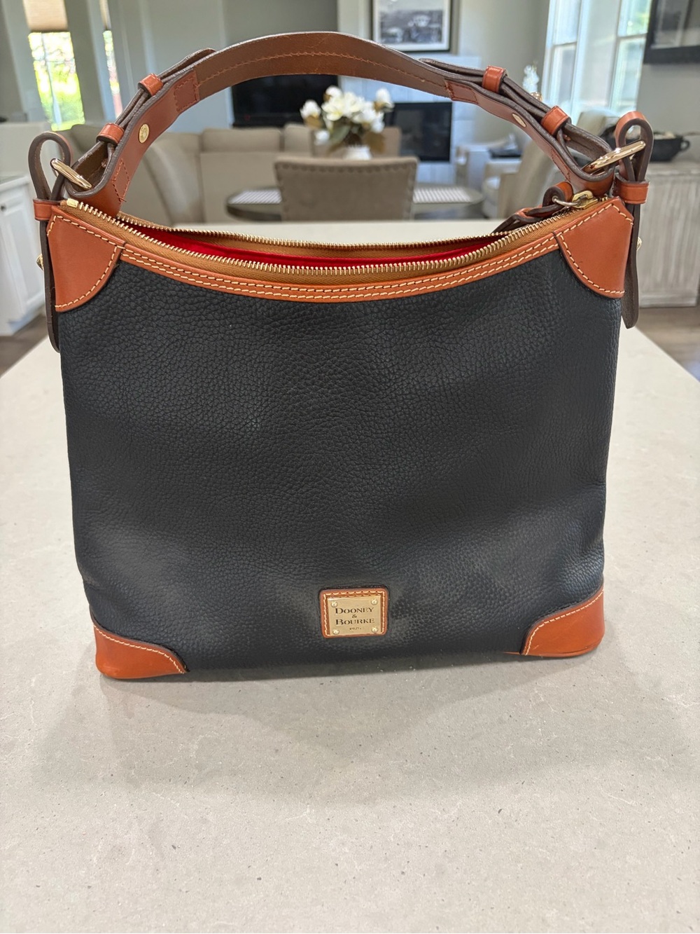 Dooney & Bourke Black Pebble Leather Shoulder Bag with Brown Trim and Red Lining